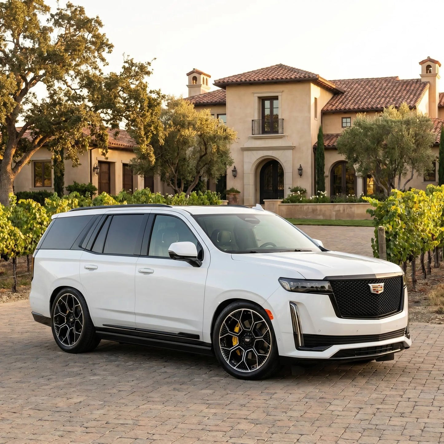 White 2024 Cadillac Escalade on 24 inch wheels by Players Club Cars