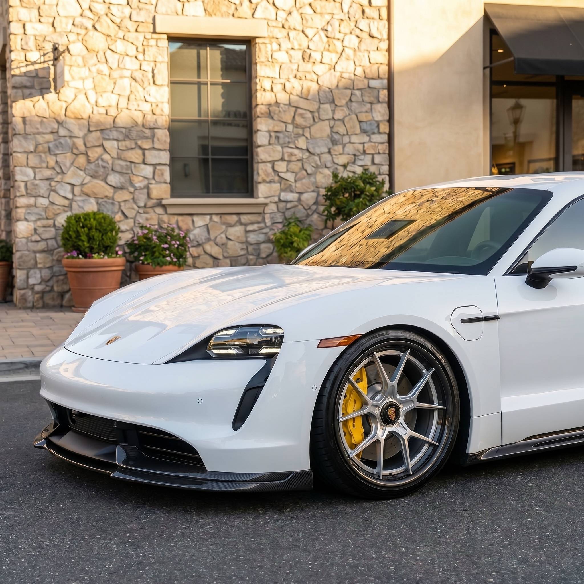 2026 Porsche Taycan Turbo S on 21-inch carbon fiber aftermarket wheels — side profile showing flush fitment